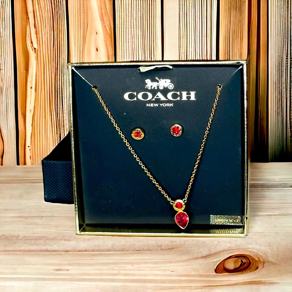 Coach - gold toned and ruby necklace and matching earrings, NIB